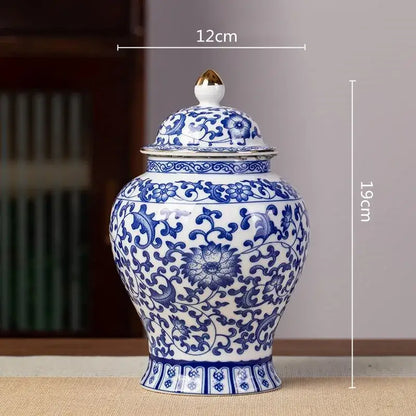 Floral blue and white porcelain tea pot storage container featuring a classic ginger jar design with gold-tipped lid