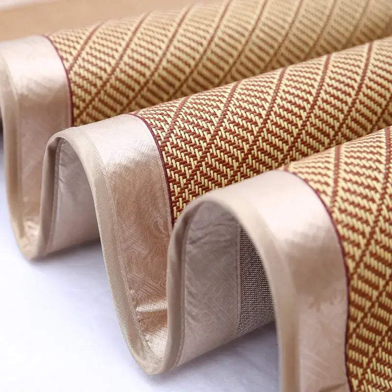 Beige and brown woven bamboo cooling rattan mat with satin-finished edge for bedroom bed pad set