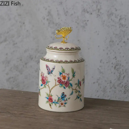 Ivory floral ceramic storage jar with vibrant motifs and golden fish finial featuring decorbites dragonfly lid