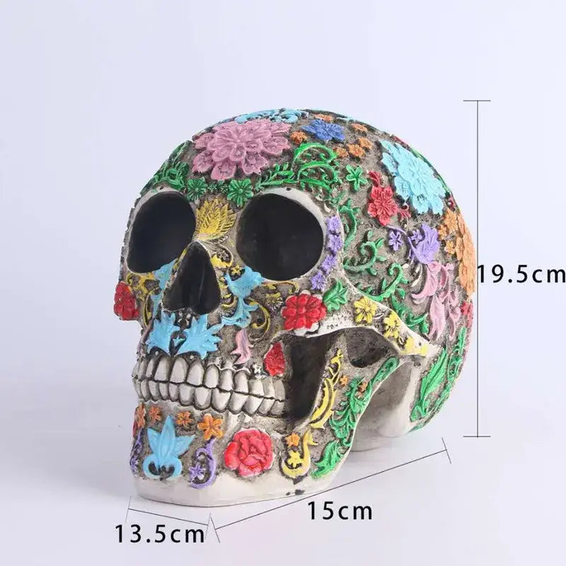 A vibrantly decorated floral colorful skull ornament with intricate pink blue red green and yellow patterns on gray base
