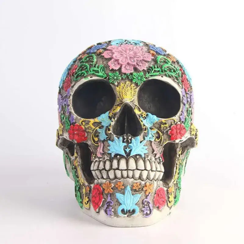 A vibrantly decorated floral colorful skull ornament with intricate patterns in pink red blue green and yellow for living room decor