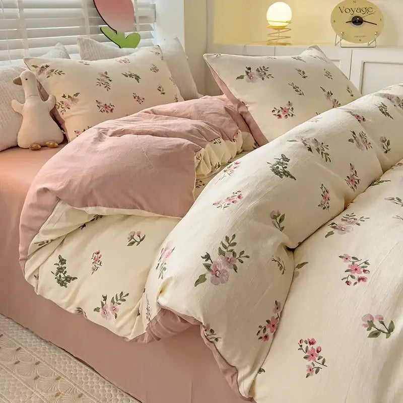 Cream floral and peach double layer cotton quilt cover set with soft pink accents and delicate green leaves design