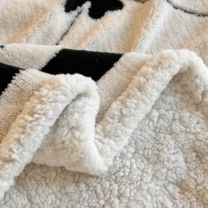 Floral cream jacquard lamb wool blanket with plush white sherpa and black beige cow print living room throw