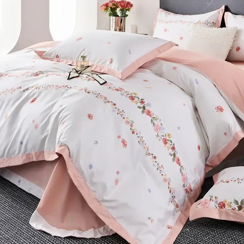 Pastel pink and white floral printed egyptian cotton bedding set with delicate embroidery and satin trim details
