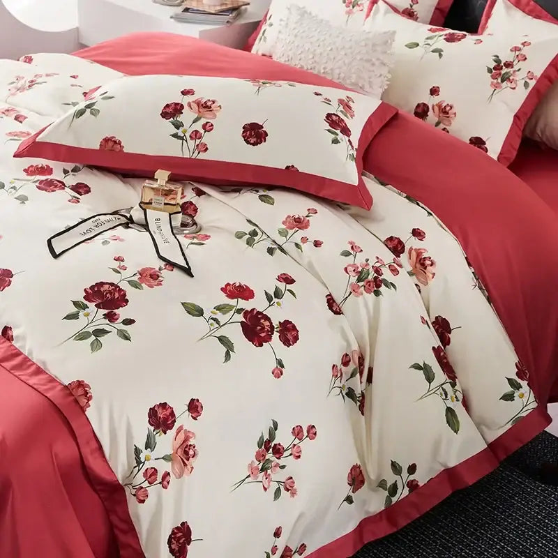 Cream-colored cotton bedding set with red and pink rose floral pattern and crimson piping in egyptian cotton bedding