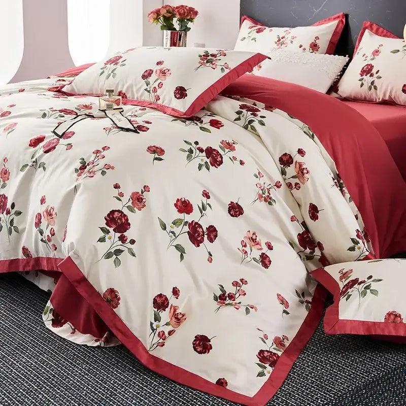 Cream-colored egyptian cotton bedding set with red and pink rose floral pattern and crimson satin trim piping