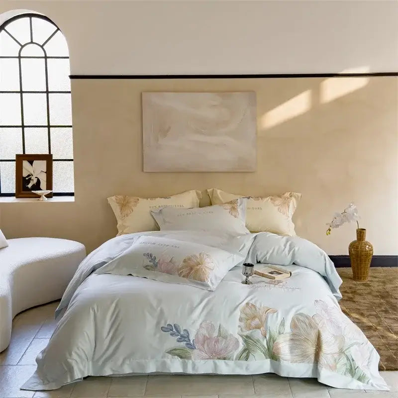 Light blue floral comforter set with pastel blossoms and embroidered design on crisp decorbites 100s egyptian cotton bed linens
