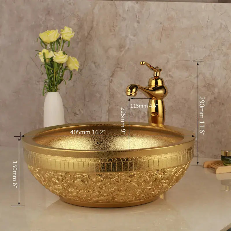 Golden ceramic washbasin with floral embossing and matching brass mixer faucet from decorbites golden ceramic set
