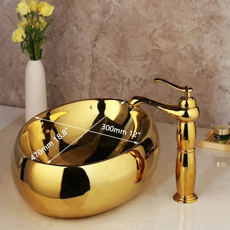 Shiny floral embossed golden ceramic washbasin with matching brass mixer faucet for elegant decorbites golden ceramic bathroom set