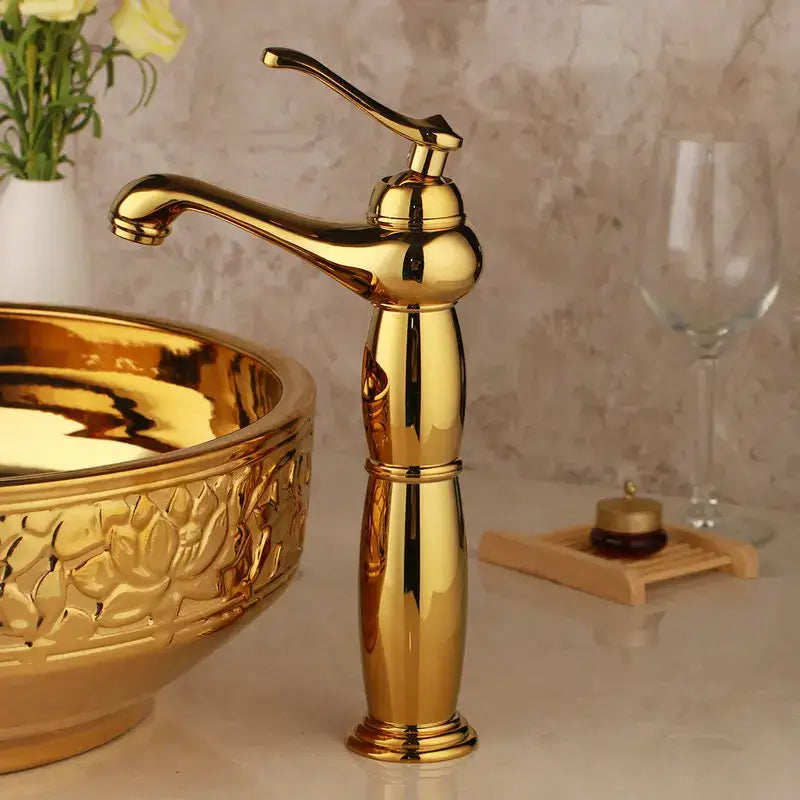 Golden polished brass mixer faucet with elegant curved spout and decorative handle for decorbites golden ceramic washbasin set