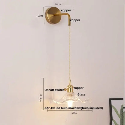Floral glass copper led wall sconce with brass finish curved arm clear glass shade and integrated on off switch