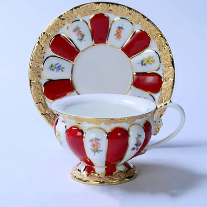 Elegant red and white porcelain tea cup saucer set with gold trim and floral motifs for dining room drinkware