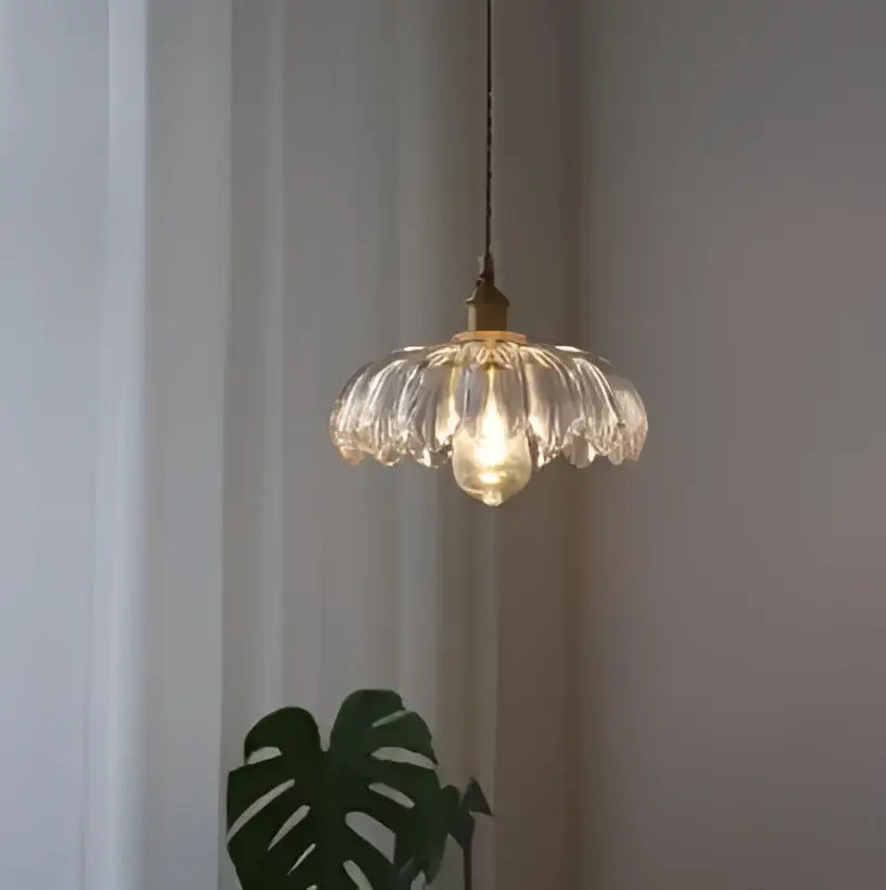 Floral green glass pendant lights with brass finish featuring delicate translucent petal-like shades for living room