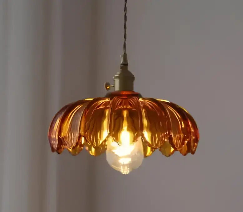 Amber-colored glass pendant lights with brass-finished metal fixture for living room glass pendant lights in golden brass