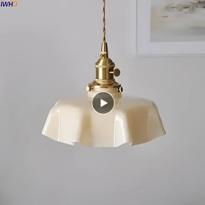 Cream-colored fluted glass pendant light with brass-finished metal fixture for living room glass pendant lights