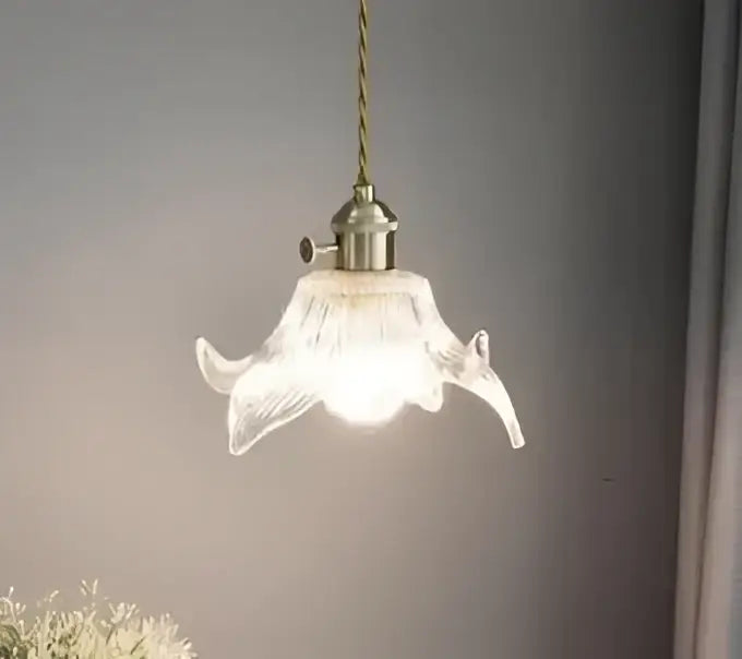A delicate translucent floral green glass pendant light with frosted white finish and golden brass for living room
