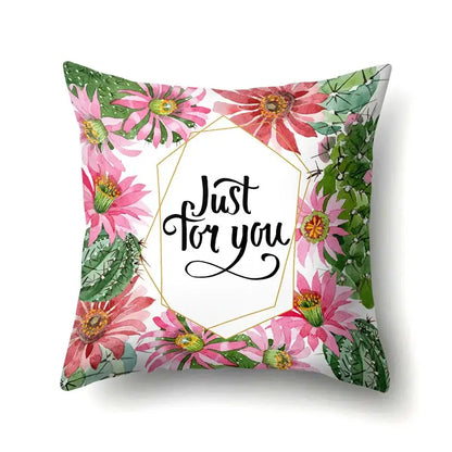 Square throw pillow cover with vibrant pink cactus flowers and green tropical leaves decorbites green tropical design