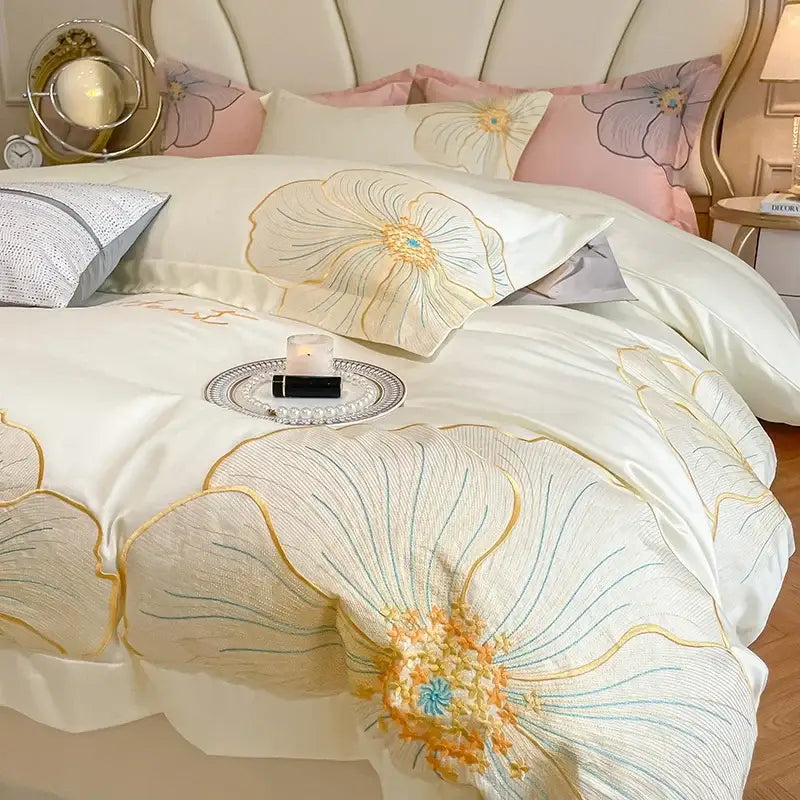 Elegant ivory satin duvet cover with intricate floral embroidery in gold blue and orange in egyptian cotton bedding set