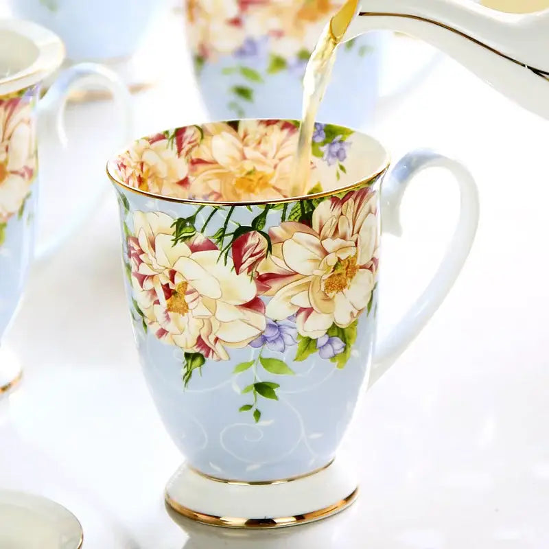 A delicate light blue porcelain teacup with floral patterns and gold trim from the decorbites bone china tea set