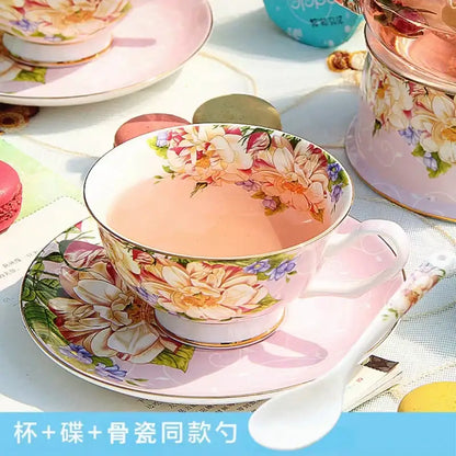 Pink floral porcelain teacup with gold trim filled with pink tea from decorbites bone china tea set dining room pitcher