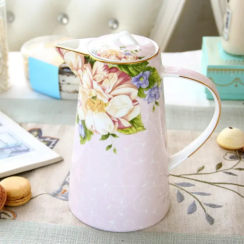Pink ceramic pitcher with floral design and gold trim from floral light blue bone china tea set by decorbites bone