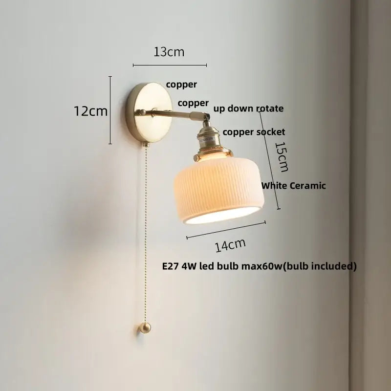 Copper-finished wall light fixture with white ceramic ridged lampshade and floral light blue glass bedroom pull chain