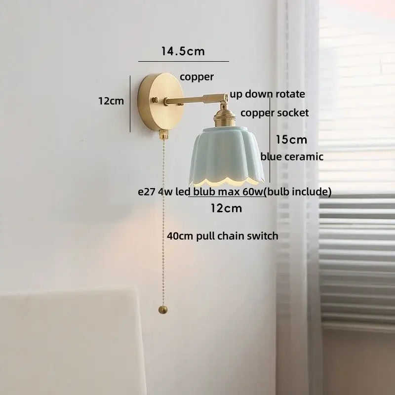 Floral light blue glass wall light fixture with a delicate ceramic lampshade and copper finish for bedroom use