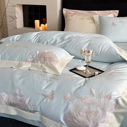 Light blue satin bedding set with intricate pink and silver floral embroidery made from decorbites 1000tc egyptian cotton