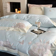 Light blue satin bedding set with intricate pink and silver floral embroidery made of decorbites 1000tc egyptian cotton