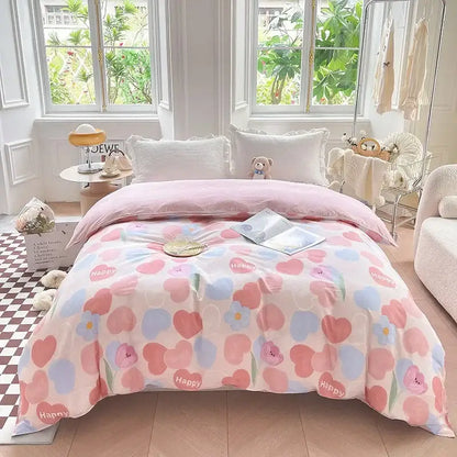 Pink floral comforter with pastel hearts and happy text made of soft cotton in a floral mint green cotton duvet cover set