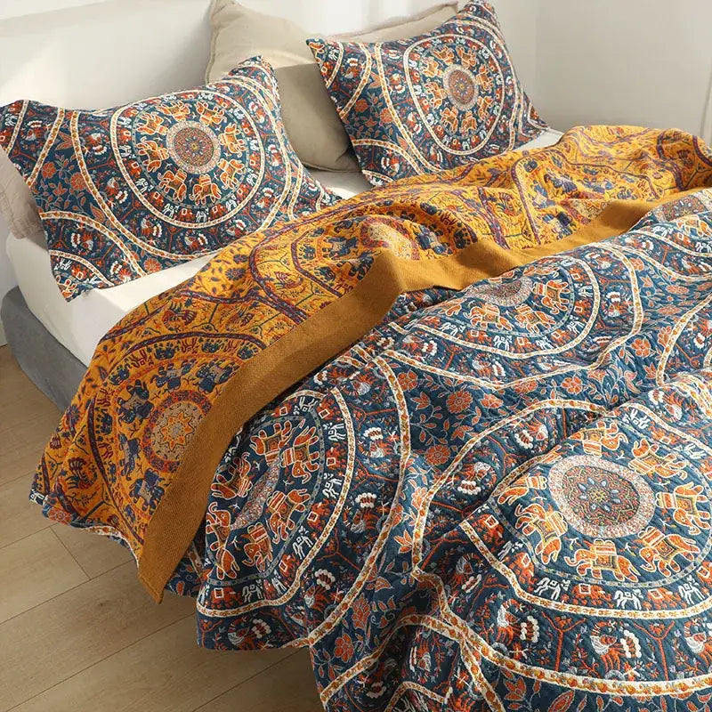 Floral navy and orange cotton picnic blanket bedspread with vibrant navy and mustard bohemian mandala patterns