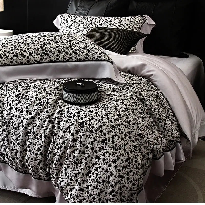 Black and white floral-patterned satin duvet cover set with ruffled edges in floral pastel cream lyocell cotton bedding set