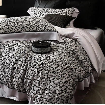 Black and white floral-patterned satin duvet cover set with ruffled edges in floral pastel cream lyocell cotton bedding set