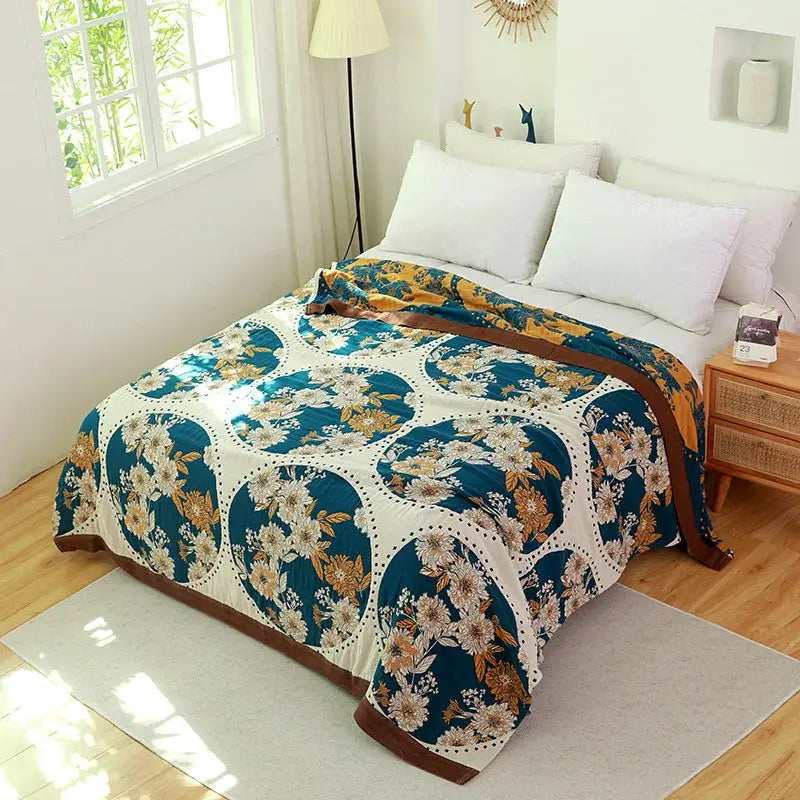 Teal and gold floral patterned decorbites cotton gauze towel blanket with white motifs and brown trim for bedroom throw