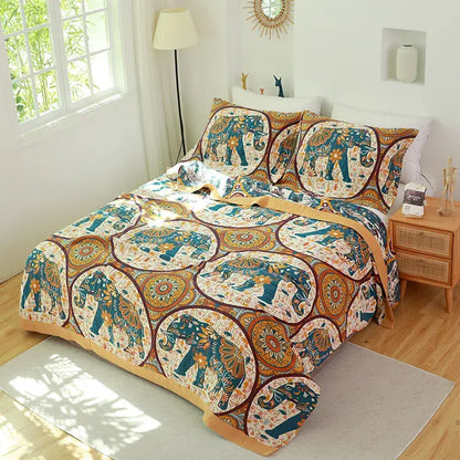 A vibrant bohemian-style decorbites cotton gauze towel blanket with blue and gold elephant motifs on cream background