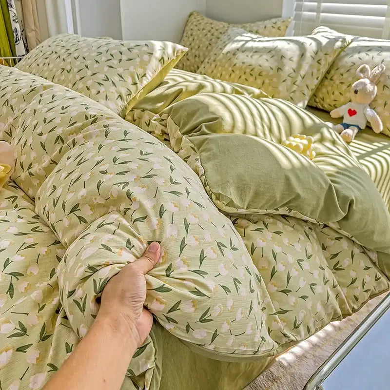 A soft pale green decorbites cotton flower printed comforter set with white blossoms and dark green leaves for bedding