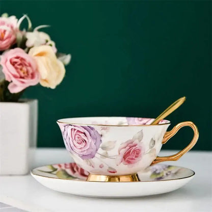Floral pink and purple porcelain tea cup set with hand-painted roses and gold trim for elegant dining room use