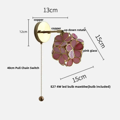 A delicate copper wall light with pink glass petals featuring decorbites butterfly glass floral design and 4w led bulb