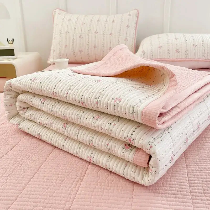 A soft folded floral pink and white quilt with pink piping for decorbites cartoon small fresh bed sheets bedroom decor