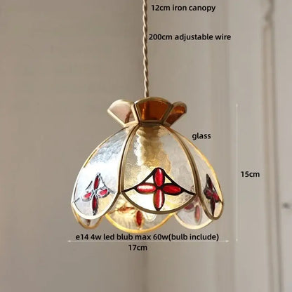 A delicate 15cm-tall pendant lamp with brass-toned iron canopy and red floral frosted glass panels for dining decorbites crown diamond glass