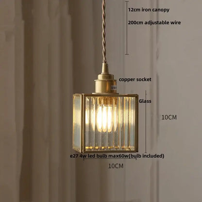 A brass-framed pendant lamp with ribbed glass panels and copper socket, perfect for decorbites crown diamond lighting