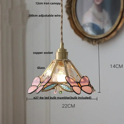 A delicate pendant lamp with brass-finished copper socket and stained glass butterfly panels for decorbites crown diamond
