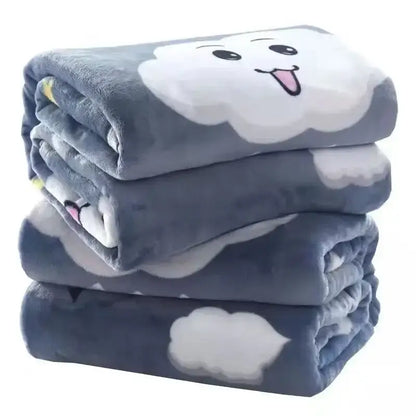 Stack of plush gray coral fleece flannel blankets with white cloud faces for cozy bedroom decorbites coral fleece decor