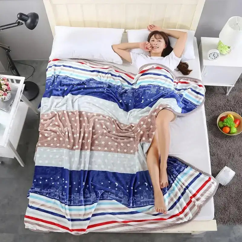 A cozy coral fleece flannel flower blanket with blue red beige stripes star patterns and cityscape decorbites coral fleece