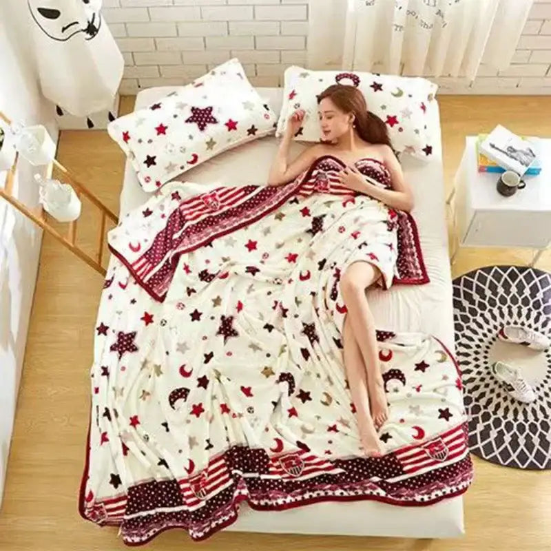 White and red star and moon patterned plush blanket with striped border made of decorbites coral fleece flannel for bedroom decor
