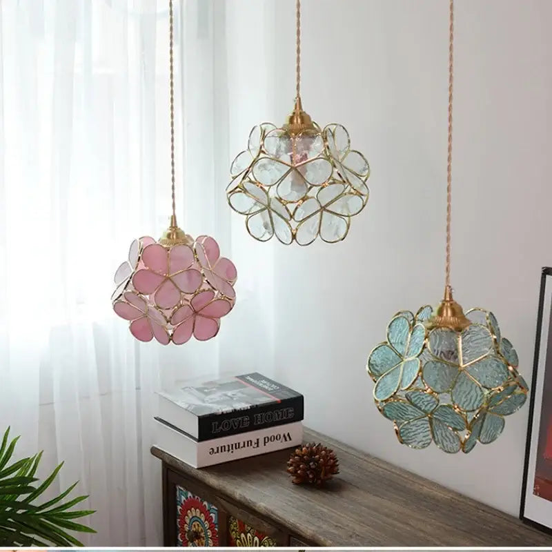 Three delicate floral stained glass pendant lights in pink clear and teal with gold copper led light fixture details