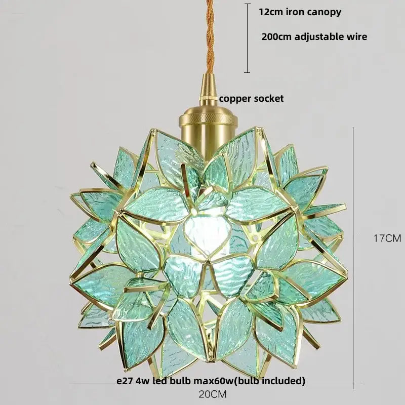 Delicate teal glass pendant light fixture with gold accents and copper socket in a floral pattern for dining room use