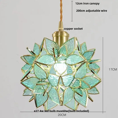 Delicate teal glass pendant light fixture with gold accents and copper socket in a floral pattern for dining room use