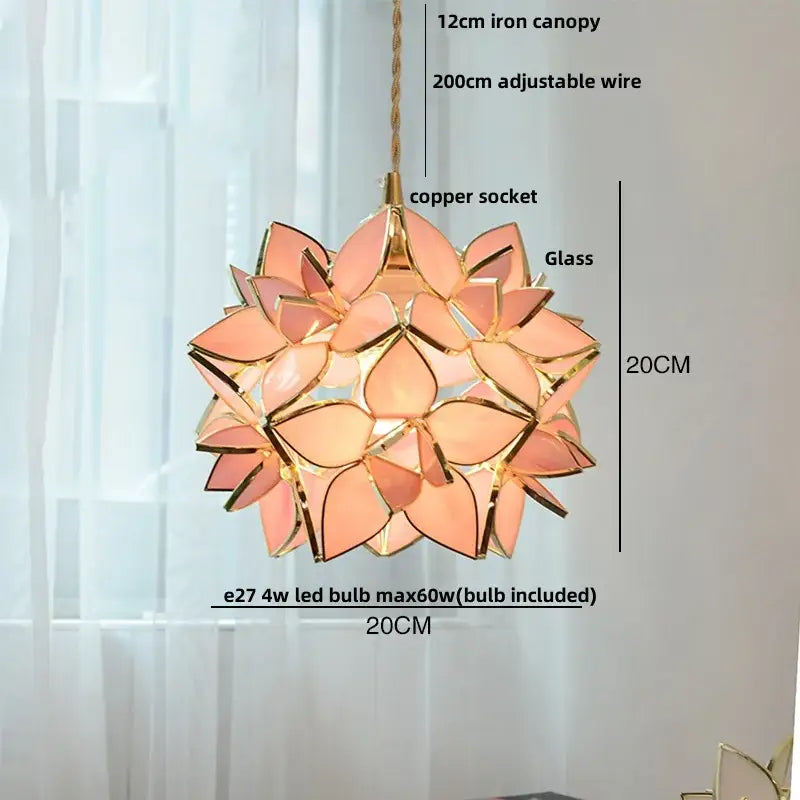 Delicate peach-colored glass copper led pendant light fixture with gold floral accents for dining room use