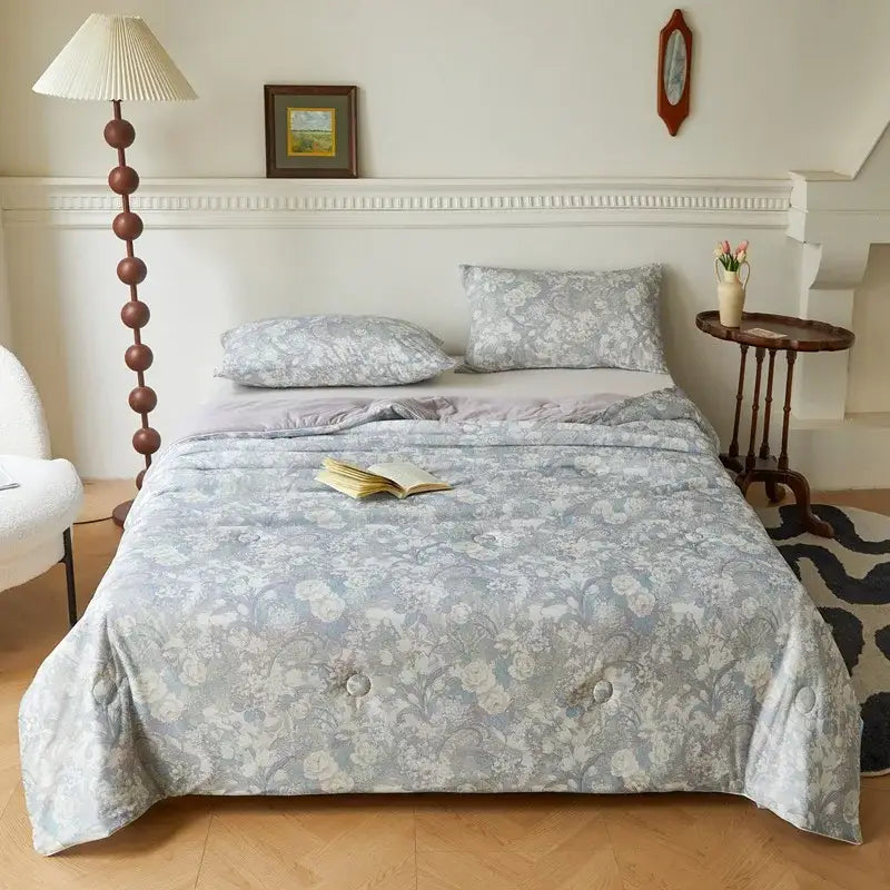 Gray floral-patterned summer quilt with subtle texture and elegant button detailing from decorbites knitted cotton print